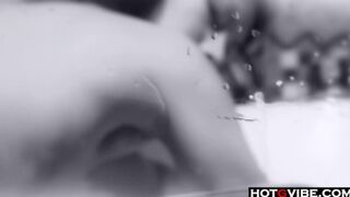 Petite Asian plays with her toys in the bathtub