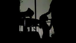 Silhouettes in the balcony at night