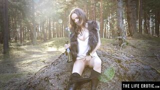Horny Brunette Fucks her Pussy with a Wine Bottle in the Woods