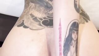 Asian girl with beautiful tattoos squirting while playing with herself
