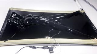 latex vacbed orgasm with vibrator and e-stim