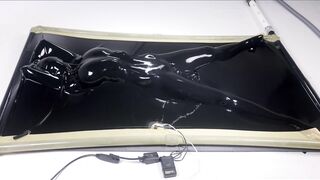 latex vacbed orgasm with vibrator and e-stim