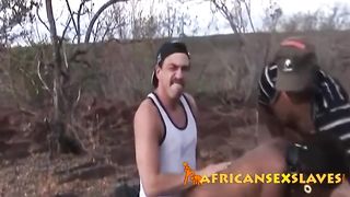 Submissive African chick gets nipples abused before fucking in kinky outdoor threesome