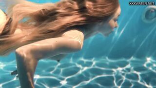Perfect body blonde teen enjoys naked swimming