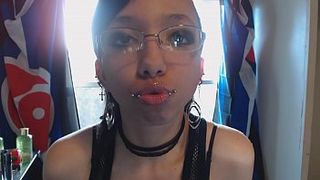 Tongue Teasing a Glass Dildo after Applying Clear Lip Gloss w/ Lip Piercings in