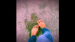 Jasmine plays in the rain barefoot!