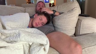 CUTE BABY SITTER NAPPING ON PARENTS LAP