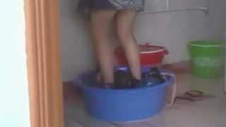 The cleaner is washing the clothes