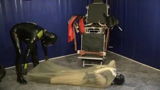 Young Latex Slave Girl in Transparent Rubber Bag with Urine Inhaler