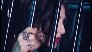 Brunette slave gets fucked in a cage by two