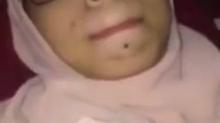 Young veiled Pakistani woman enjoying practice