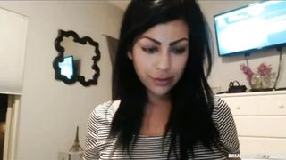 Busty beauty playing with her ass on a webcam