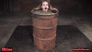Bdsm babe trapped in a barrel and electrified